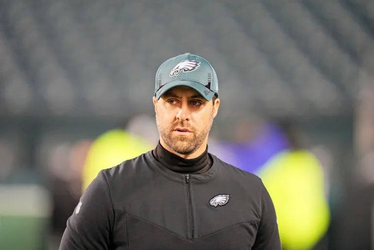 Eagles passing game coordinator Kevin Patullo looks on during warm-ups ahead of Tuesday's game against Washington.