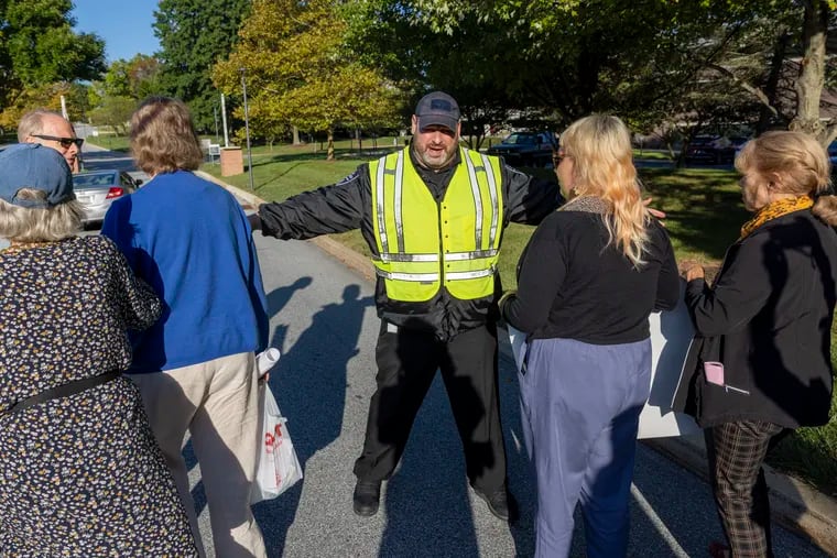 A security officer blocked members of the Quaker group, Earth Quaker Action Team, from entering Vanguard's property in Malvern in September.