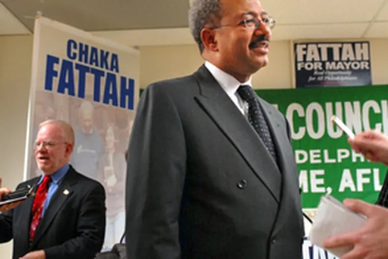 Mayoral candidate Chaka Fattah (right) received the endorsement of AFSCME District Council 47 yesterday. Speaking into microphones at left is district council president Thomas P. Cronin.