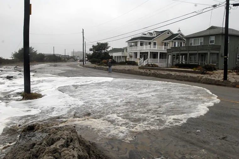 File: Water from the Atlantic Ocean washes over East Atlantic Avenue in Ocean City in a previous nor'easter. (Ron Tarver / Staff Photographer)