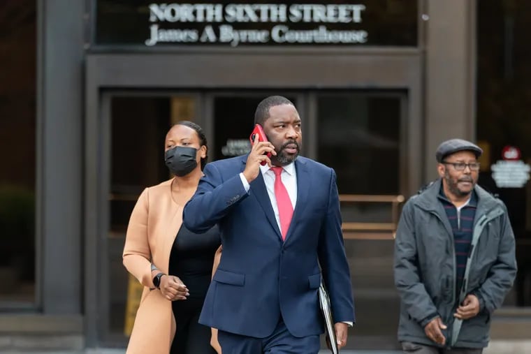 Philadelphia City Councilmember Kenyatta Johnson, center, and his wife Dawn Chavous, left, exit the federal courthouse in Center City on Wednesday after closing arguments in their federal bribery trial.