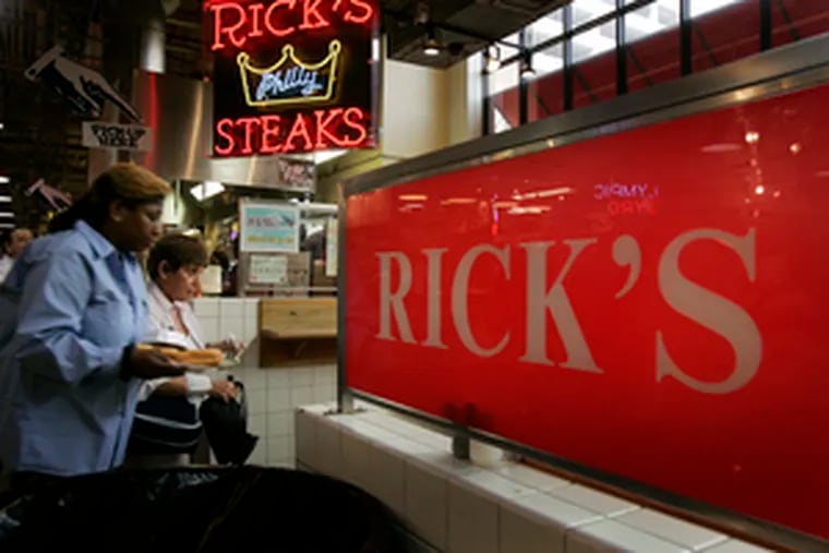 Lunch customers line up at Rick&#0039;s Original Philly Steaks at the Reading Terminal Market. &quot;We&#0039;re still operating, and things are going very well,&quot; owner Rick Olivieri said.