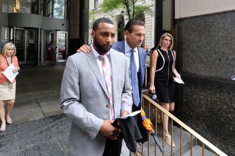Jovan Weaver, in foreground, who recently resigned as principal of John Wister Elementary, a Mastery Charter School, waived his preliminary hearing Tuesday, June 18, 2019, on vehicular homicide and related offenses for a 2017 fatal crash that killed a pedestrian on City Avenue. He is accompanied leaving the Stout Center for Criminal Justice with his attorney, Fortunato "Fred" Perri Jr.
