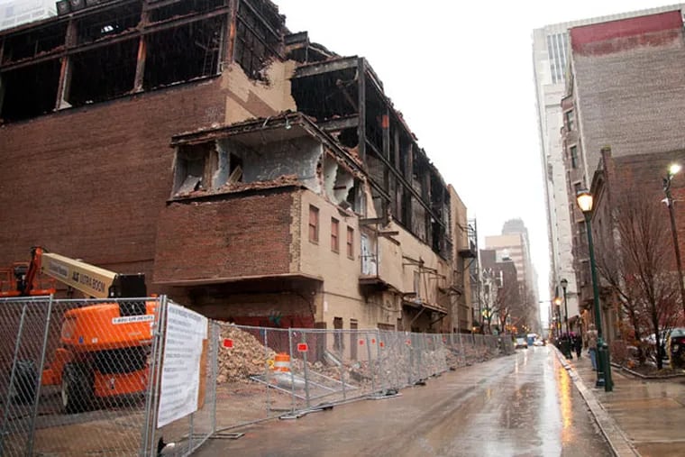 The destruction of the historic Boyd Theater has begun on the Sansom Street side. (Emily Cohen / For the Inquirer)