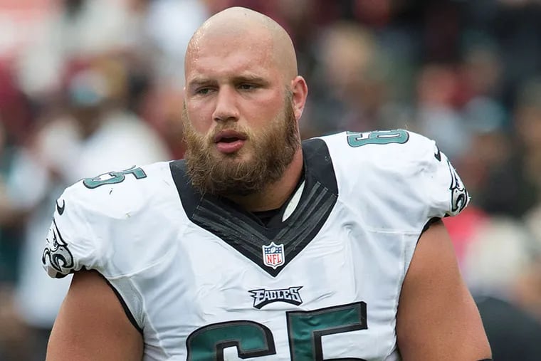 Eagles offensive tackle Lane Johnson gingerly walks off the field.
