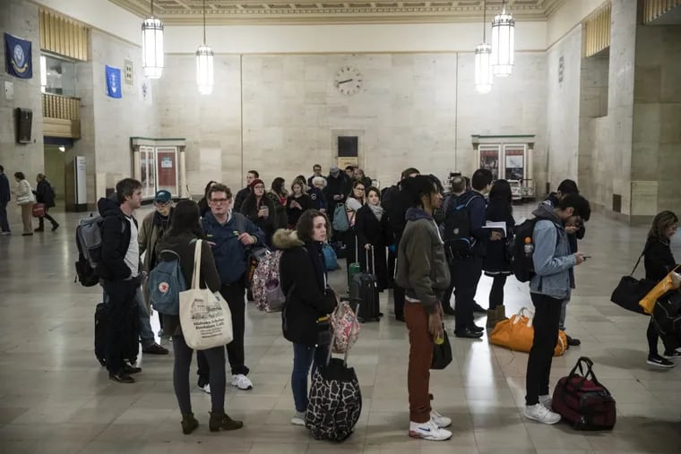 A record number of travelers are expected to drive, fly, and take buses and trains for the upcoming holidays. Passengers here wait to board a train ahead of  Thanksgiving at 30th Street Station in Philadelphia.