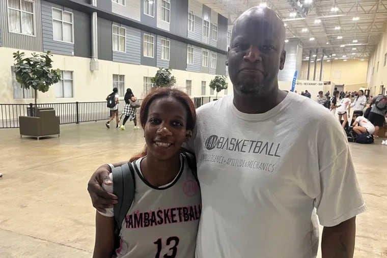 Mikel Lancit (left) and her dad, Rashim Lancit, pose for a photo after an AAU practice.
