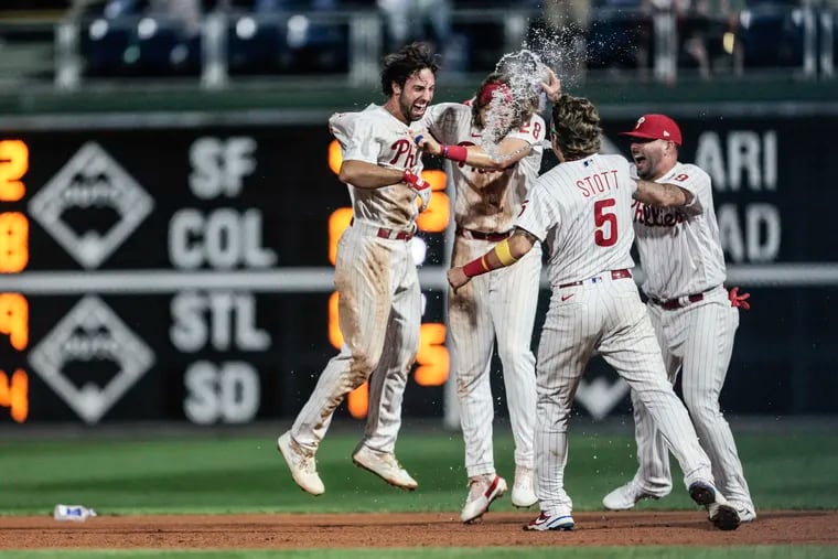 Phillies Matt Vierling, left celebrates his walk-off base hit with teammates against the Blue Jays in the 10th inning at Citizens Bank Park in Philadelphia, Wednesday,  September 21, 2022 Phillies walk off in the 10th inning to beat the Blue Jays 4-3.