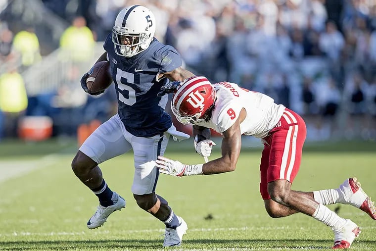 Penn State wide receiver DaeSean Hamilton runs with the ball as Indiana defensive back Jonathan Crawford tries to bring him down on Saturday, Sept. 30, 2017, at Beaver Stadium in Universtiy Park, Pa. The host Nittany Lions won, 45-14.