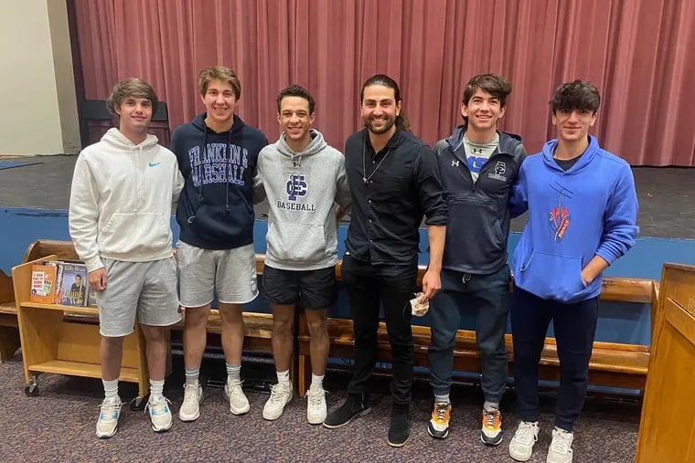 Bryan Ruby (center), surrounded by current Friends' Central baseball players, was back at his alma matter this past week to promote his organization Proud to be in Baseball.