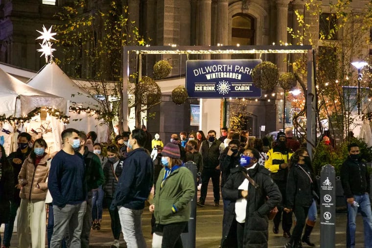 People gather in front of City Hall for holiday festivities amid the pandemic on Nov. 27.