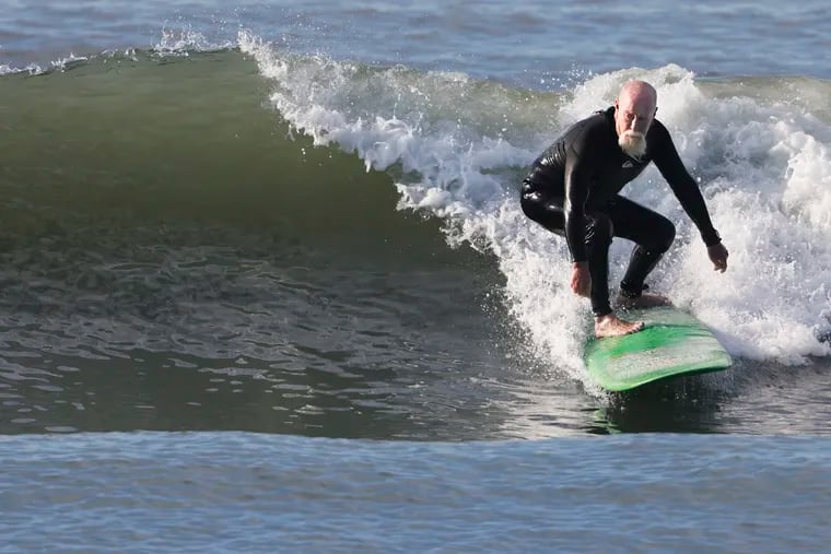 Joe Lang of Hatboro surfs near East 6th Ave. in North Wildwood, N.J. on May 29, 2022. Lang said he’s been catching the waves for 45 years and loves the beach.