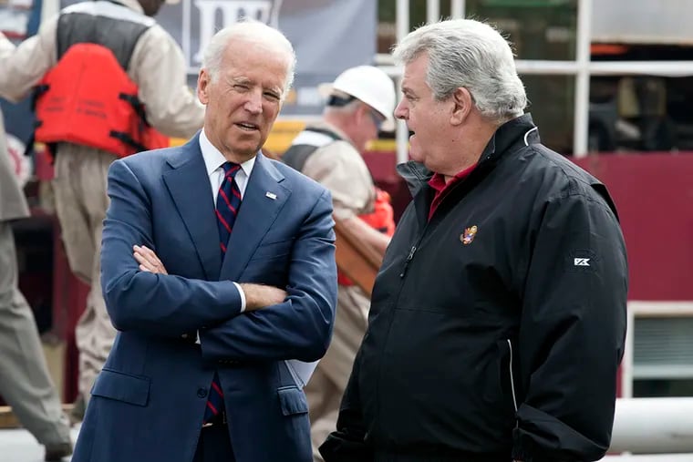 Vice President Joe Biden, left, and Congressman Bob Brady, right, talk after touring a dredging barge and during a press conference about strengthening America's infrastructure held at the Great Plaza at Penn's Landing, Thursday, October 16, 2014.  (Jessica Griffin/Staff Photographer)