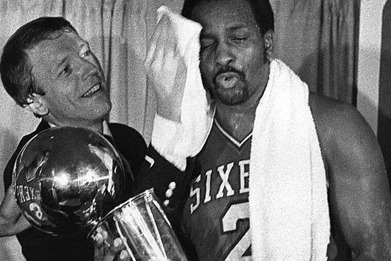 Sixers coach Billy Cunningham wipes Moses Malone's brow during 1983 NBA championship celebration. (George Reynolds/Daily News file photo)