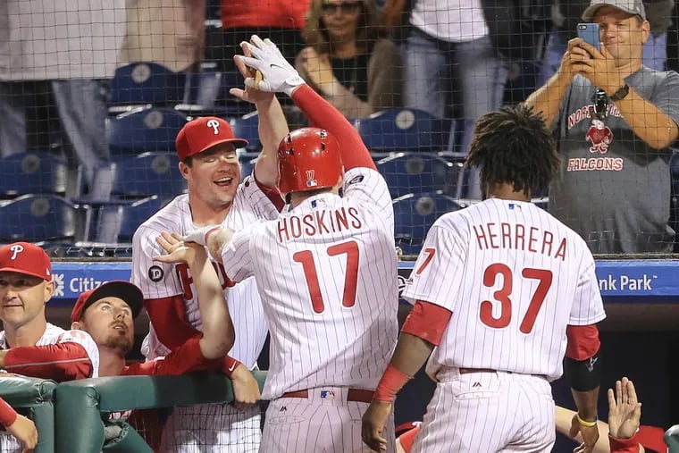Rhys Hoskins celebrates his solo homer with teammates against the Marlins on Sept. 12, 2017. STEVEN M. FALK / Staff Photographer