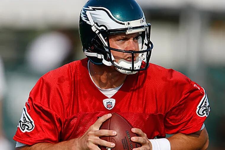 Kevin Kolb scrambles with the ball during Eagles practice. (David Maialetti / Staff Photographer)