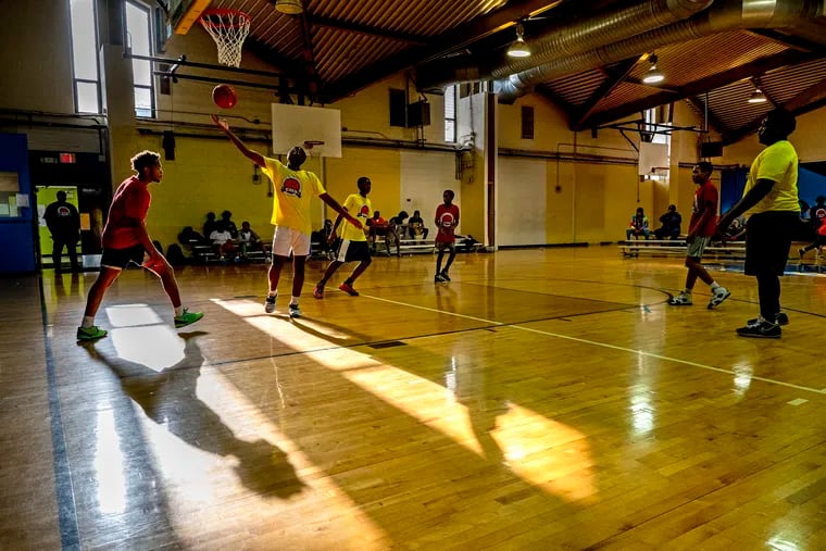 Youngsters play in the Eugene Broadwater 3-on-3 Classic at the A.W. Christy Recreation Center in West Philadelphia Thursday. It is one of dozens of rec centers in Philadelphia that will soon have funded weekend hours.