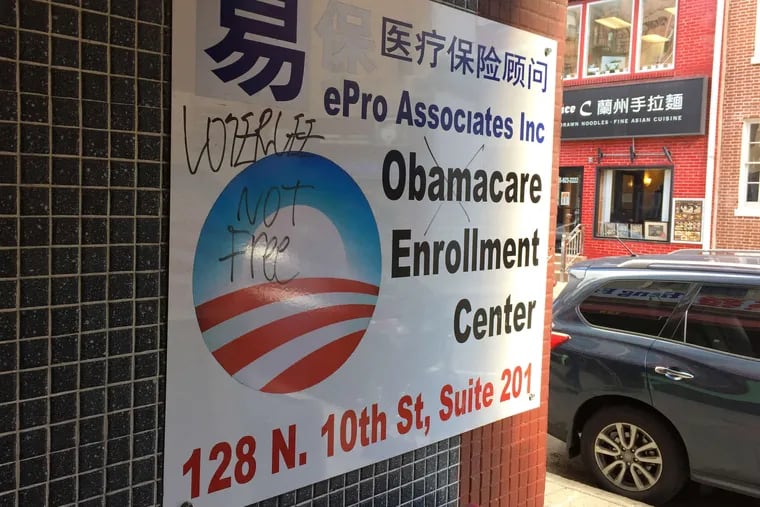 A sign at an insurance brokerage in Philadelphia's Chinatown section advertises Obamacare sign-ups. Affordable Care Act plans in Southeastern Pennsylvania and New Jersey have unusually broad physician networks, according to an analysis from the University of Pennsylvania's Leonard Davis Institute of Health Economics.