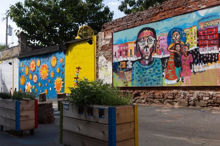 A look inside of Prevention Point's newly opened Love Lot in Kensington, including a mural (right) painted by Ashley Flynn. The Love Lot is adjacent to Prevention Point's building and will be a community hub and host space for the organization's services.