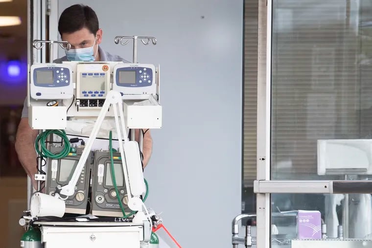 In this file photo from April 2020,  chief nursing officer Dave Schmidt inspects a ventilator at Suburban Community Hospital in East Norriton Township.