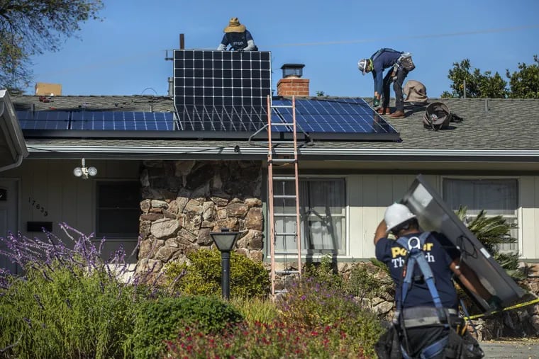 Workers for Sunrun install solar panels on the roof of a home in Granada Hills, Calif., a state that has a hot spot for solar energy. Researchers at the Lawrence Berkeley National Laboratory have examined how various policies and business models could make solar power more affordable for people at all incomes.