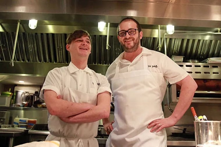 Chef Nicholas Bazik (left) and chef-owner Peter Woolsey of La Peg, where the kitchen is trending in the right direction.