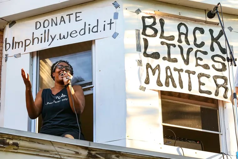 Guest singer Nikki Starr sings during a rooftop, socially distanced concert  "Pat Finnerty & the Full Band" to support Black Lives Matter in West Philadelphia, Tuesday,  June 9, 2020
