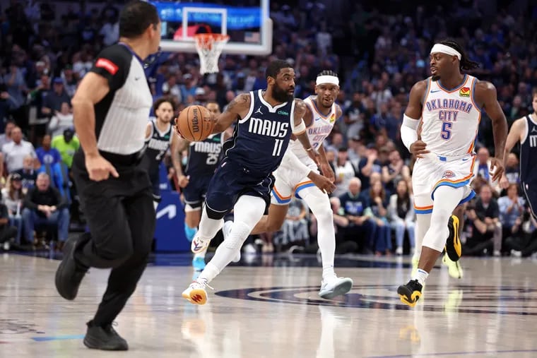 Kyrie Irving #11 of the Dallas Mavericks dribbles by Luguentz Dort #5 of the Oklahoma City Thunder during the third quarter in Game Three of the Western Conference Second Round Playoffs at American Airlines Center on May 11, 2024 in Dallas, Texas. (Photo by Tim Heitman/Getty Images)