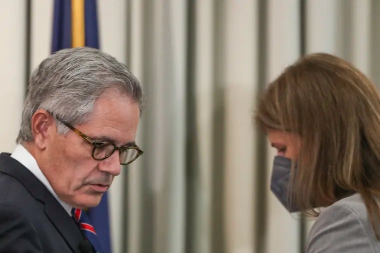Philadelphia District Attorney Larry Krasner, left, and former prosecutor Patricia Cummings at a 2021 news conference where charges were announced against former detectives Martin Devlin, Manuel Santiago, and Frank Jastrzembski.
