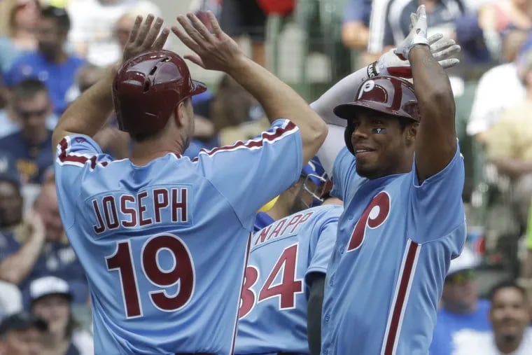 Philadelphia Phillies' Nick Williams celebrates his grand slam with teammate Tommy Joseph during the sixth inning of a baseball game against the Milwaukee Brewers Sunday, July 16, 2017, in Milwaukee. (AP Photo/Morry Gash)