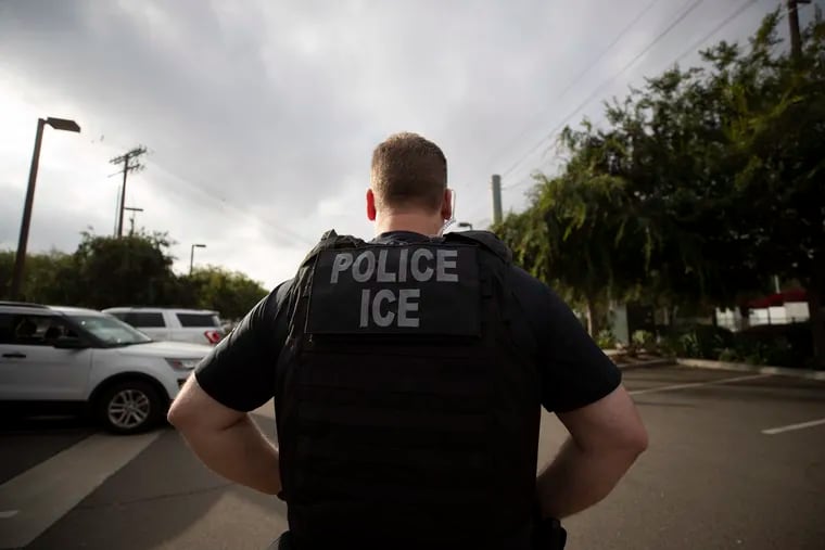 A U.S. Immigration and Customs Enforcement (ICE) officer at work in Escondido, Calif., in 2019