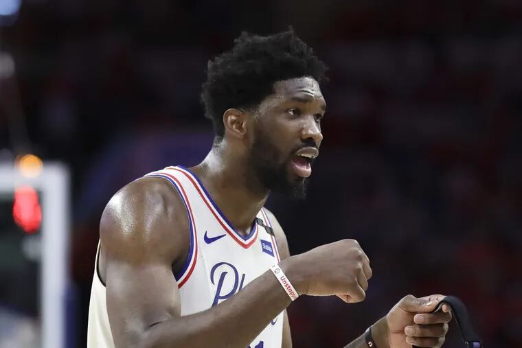 Sixers center Joel Embiid talks to game officials after a altercation with Boston Celtics guard Terry Rozier during the second-quarter in game four of the Eastern Conference semifinals on Monday, May 7, 2018 in Philadelphia. YONG KIM / Staff Photographer