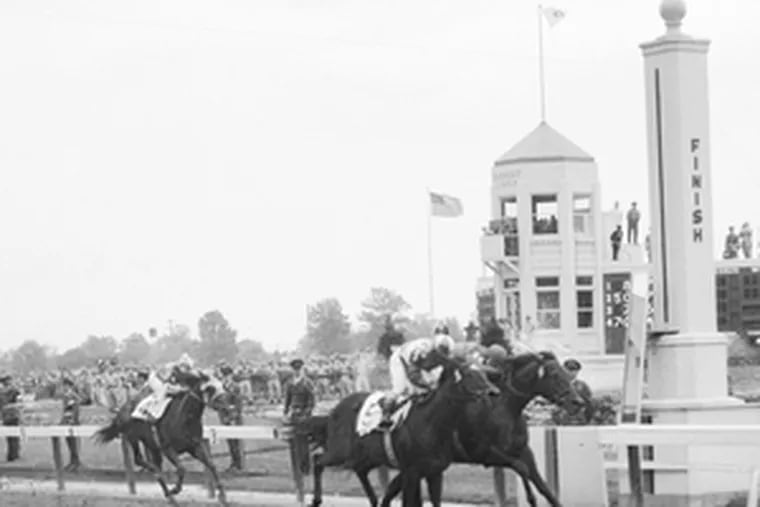 Bill Shoemaker, on the outside, rides Gallant Man to second-place finish behind Iron Liege in 1957 Kentucky Derby.