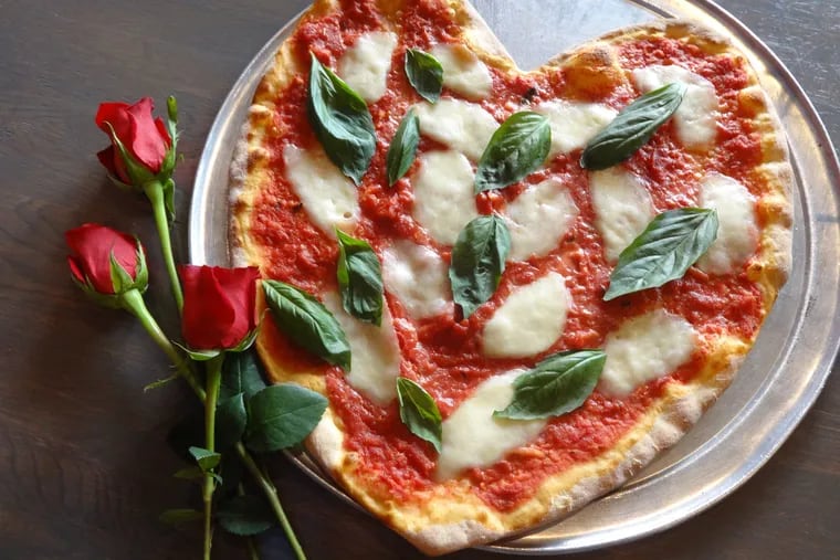 Forget vying for a reservation at a booked restaurant and call in an order for heart-shaped pizza instead.