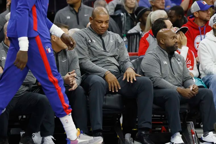 Sixers coach Doc Rivers settles back into his seat after a missed shot by Joel Embiid during the Milwaukee Bucks at Philadelphia 76ers NBA game at the Wells Fargo Center in Phila., Pa. on Thursday, October 20, 2022.
