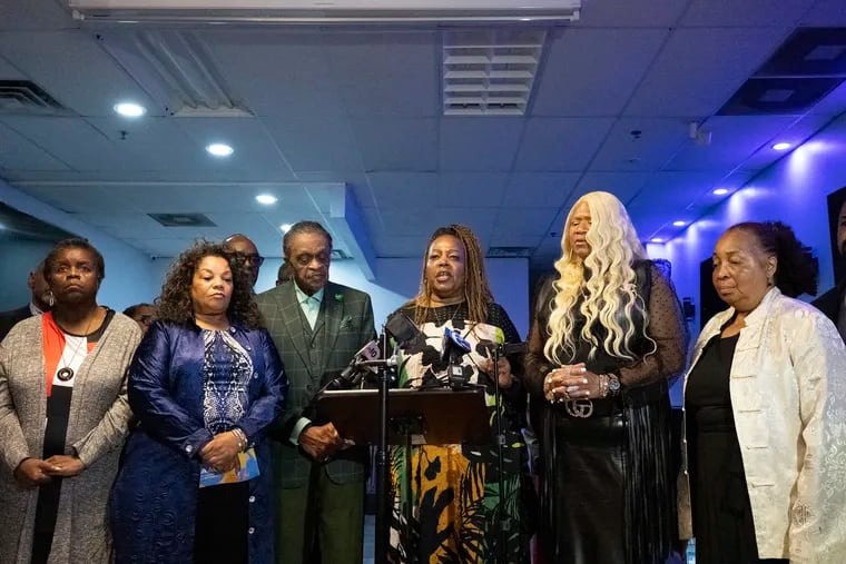 Sheriff Rochelle Bilal, center, stands with Black Clergy of Philadelphia on Thursday during a NAACP news conference to denounce the decision made by a Philadelphia Judge to drop all charges against Philadelphia Police Officer Mark Dial in the shooting death of Eddie Irizarry.