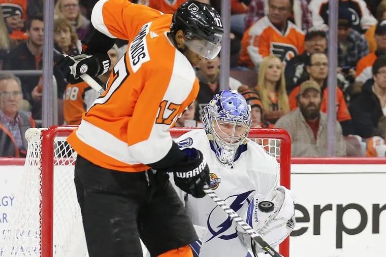 Right winger Wayne Simmonds, shown trying to tip the puck past Tampa Bay goaltender Andrei Vasilevskiy last month, will play in his 500th game with the Flyers on Tuesday in Carolina.