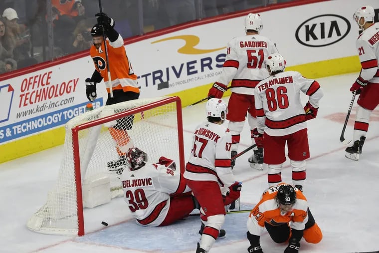 Sean Couturier celebrates after scoring in the third period Thursday night during the Flyers' 4-1 victory over the Carolina Hurricanes.