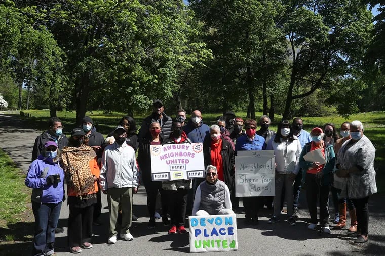 Residents, mainly of Devon Place, gather for a photo at the Awbury Arboretum earlier this month. The residents are protesting a proposal from the arboretum board to build a 5,000-square-foot building and parking lot outside of their grounds.