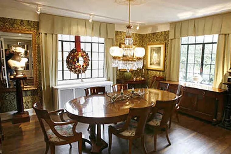 The dining room of the Wyndmoor home Dino and Michael Kelly-Cataldi bought in 2007. The 1931 Tudor Revival was owned by the Samtmann family, who operated a rose nursery on the property until 1973. (Charles Fox / Staff Photographer)