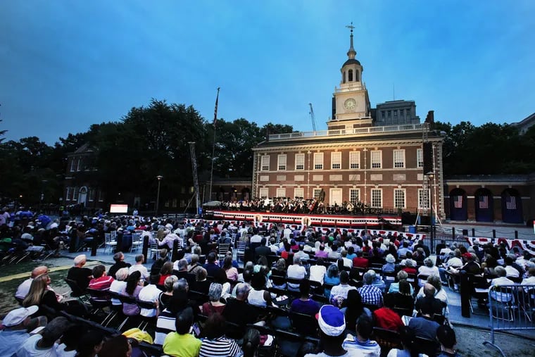 Conductor Michael Krajewski presided over a program of Americana with the Philly Pops at Independence Mall.  STEVEN M. FALK / Staff Photographer