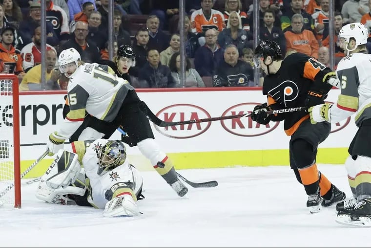 Flyers center Jordan Weal shots the puck stopped by Vegas Golden Knights goaltender Marc-Andre Fleury, with defenseman Jon Merrill and defenseman Colin Miller (right) during the first-period on Saturday, October 13, 2018 in Philadelphia.