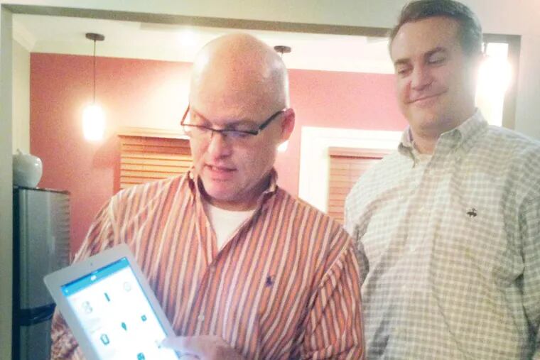 Zonoff CMO Bob Cooper and CEO Mike Harris show off their software steering the Staples Connect home automation system.