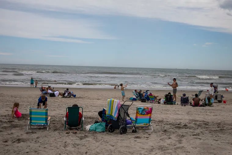 Beachgoers setup along the beach enjoying the weather at Margate City Beach on Saturday, May 23, 2020. The Jersey Shore opens up for the first holiday weekend amid the coronavirus.