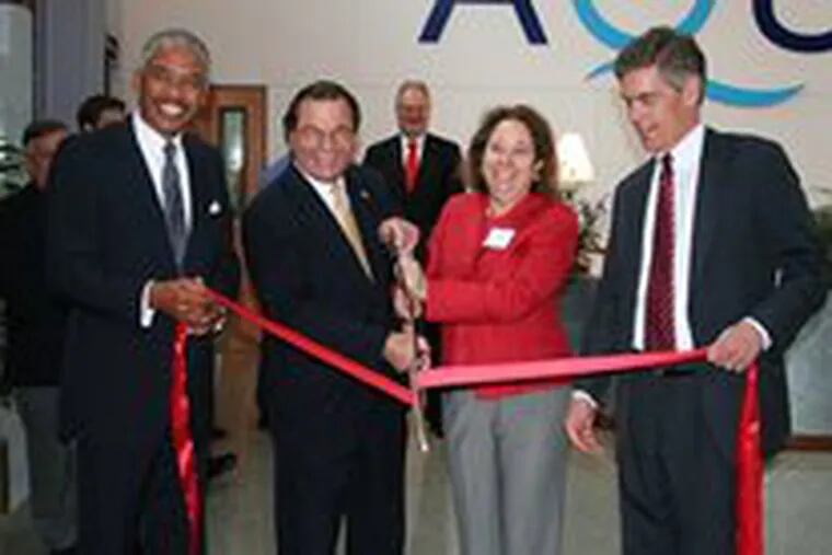 The dedication ceremony at Aqua America Inc. in Bryn Mawr drew(from left) Wendell Holland, chairman of the Pennsylvania Public Utility Commission; company chief Nicholas DeBenedictis; State Sen. Connie Williams; and Lower Merion Commissioner Scott Zelov.