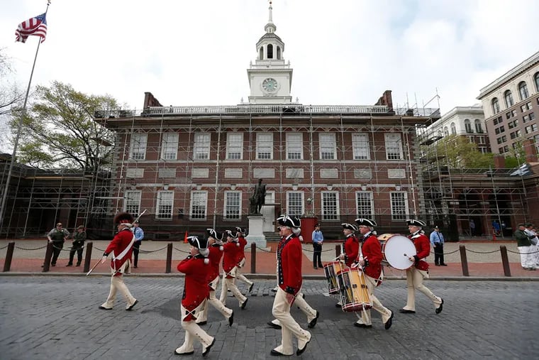 Members of the United States Army Old Guard Fife and Drum Corps march in front of Independence Hall, where the Constitution was debated and adopted, during the opening ceremony of the Museum of the American Revolution in Philadelphia, PA on April 19, 2017.