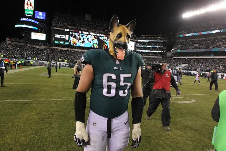 Eagle offensive lineman Lane Johnson dons a dog mask after beating the Falcons to advance to the 2018 NFC championship game.