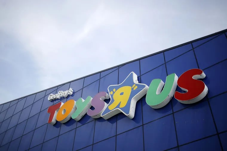 FILE - Signage is displayed outside a Toys R Us Inc. retail store in Louisville, Ky., on Sept. 18, 2017.