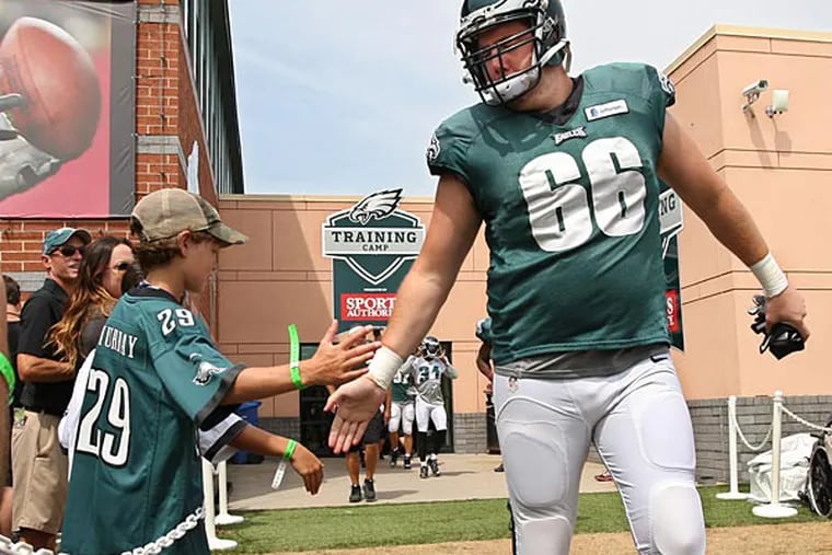 Eagles offensive lineman Andrew Garner greets a young fan. (Michael Bryant/Staff Photographer)