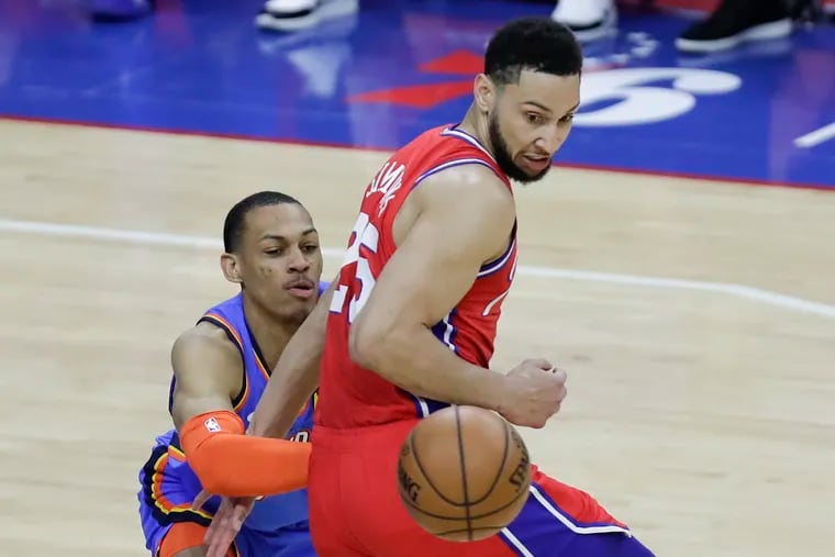 Sixers guard Ben Simmons (right) steals the basketball from Oklahoma City Thunder forward Darius Bazley.